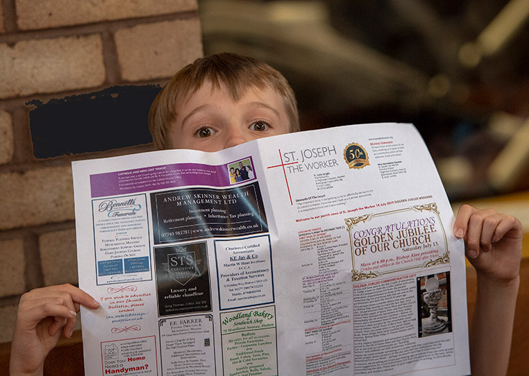 Child reading newsletter